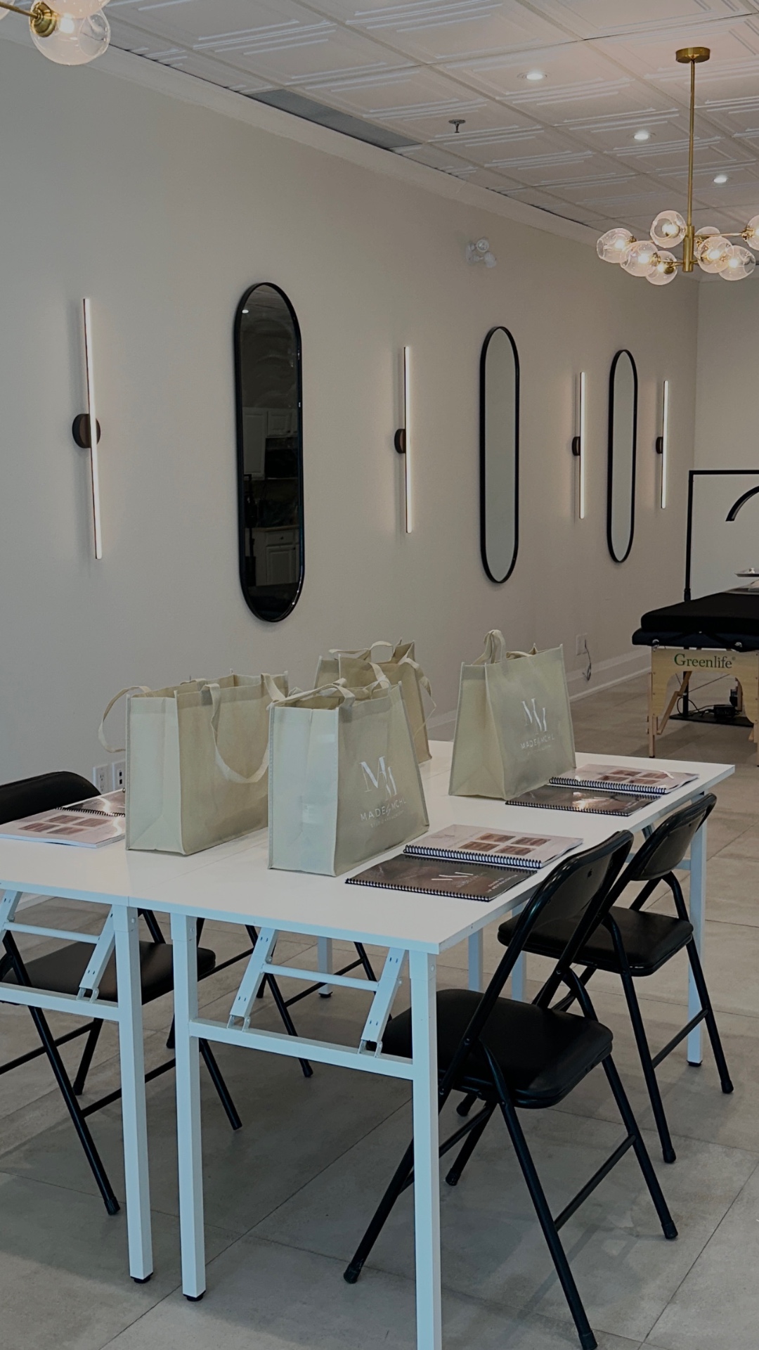 MADEBYMCHL academy classroom with branded welcome kits and training manuals